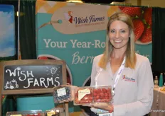 Amber Maloney with Wish Farms proudly shows blueberries and raspberries.
